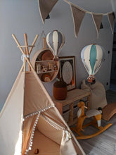 Load image into Gallery viewer, Children's room with a teepee, rocking horse, and hot air balloon decorations.
