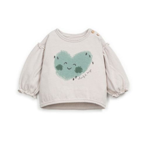 Baby sweater with a heart design on a white background