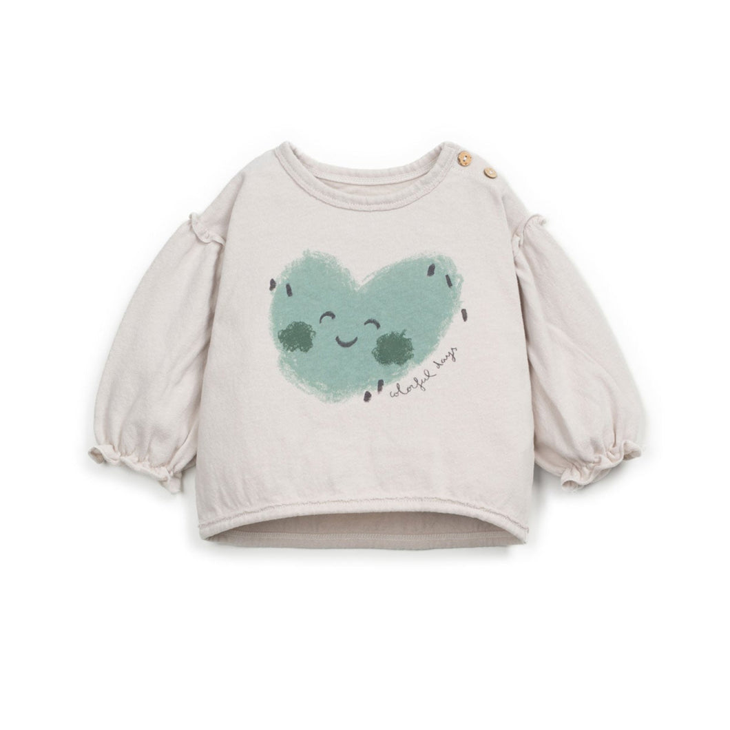 Baby sweater with a heart design on a white background