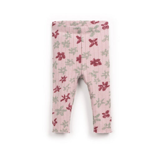 Pink leggings with floral pattern on a white background