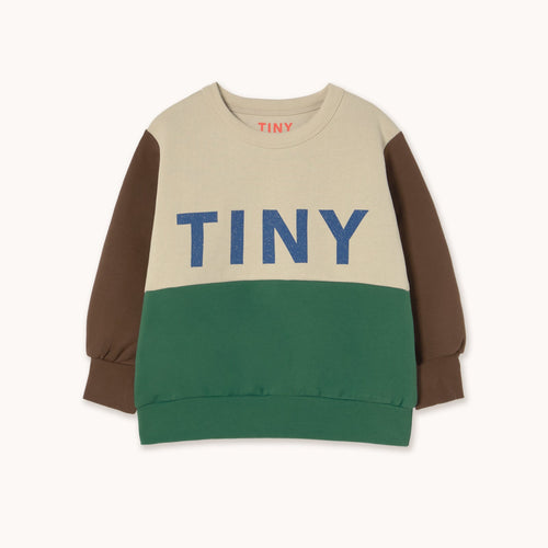 Color-blocked sweater with 'TINY' text on a white background