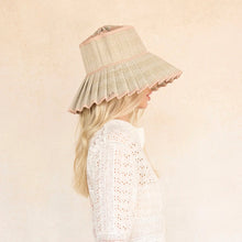 Load image into Gallery viewer, Woman wearing a white lace dress and a beige sun hat against a plain background
