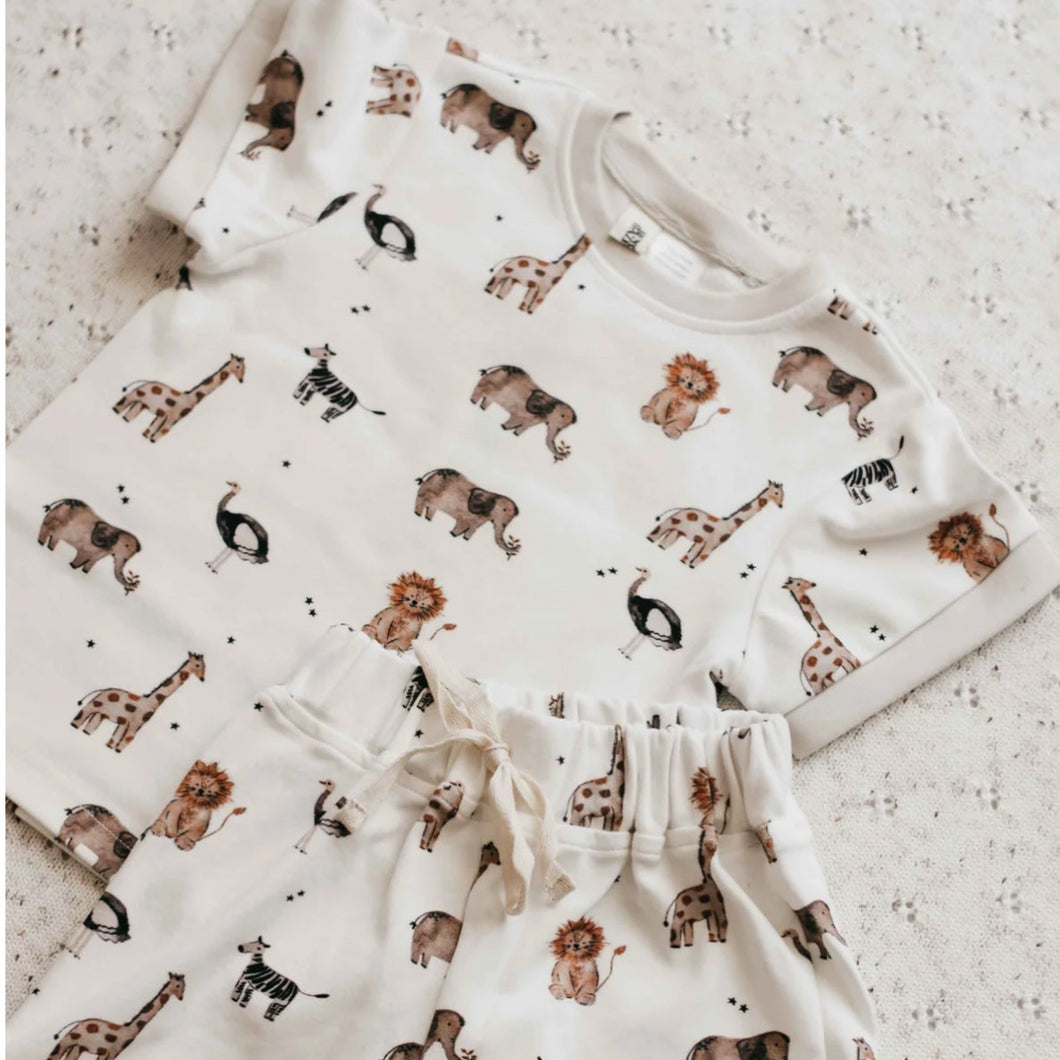 Baby outfit with animal print on a textured surface