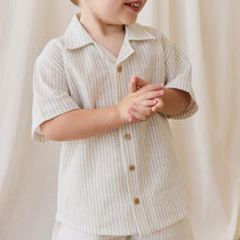 將圖片載入圖庫檢視器 Child wearing a light-colored striped shirt and shorts against a white curtain background
