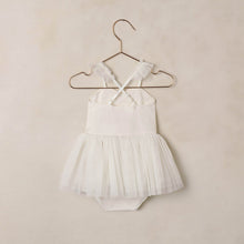 Load image into Gallery viewer, White baby romper with lace details on a beige hanger against a beige background
