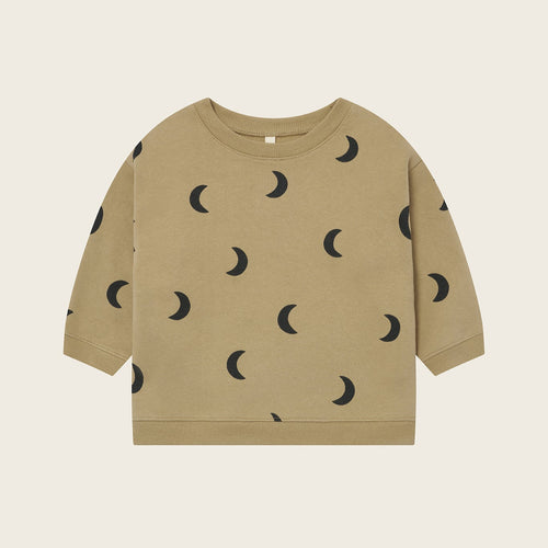 Beige sweatshirt with black moon pattern on a beige background