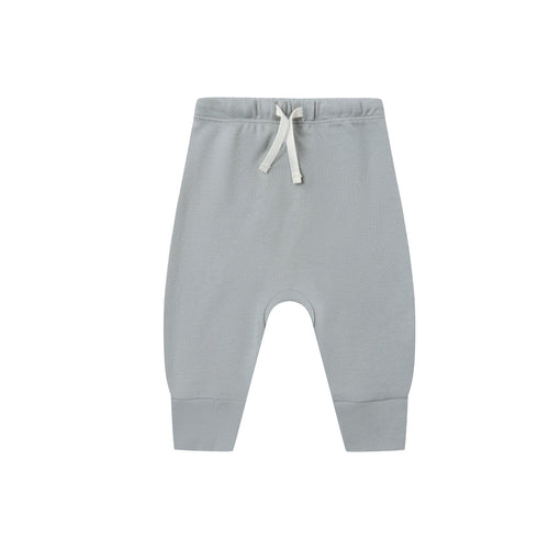 Light gray sweatpants with a drawstring on a white background