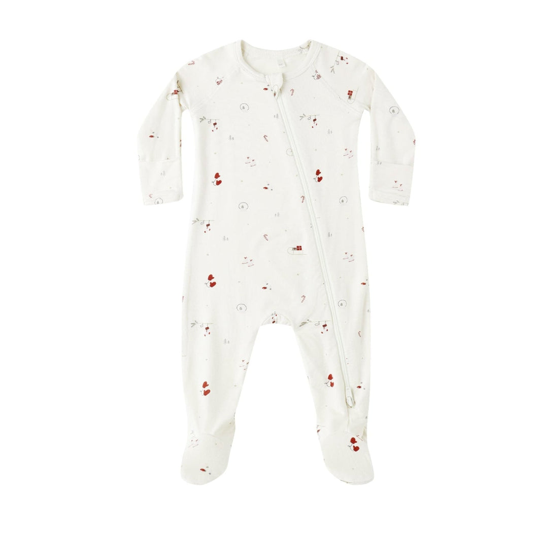 White baby onesie with red patterns on a white background