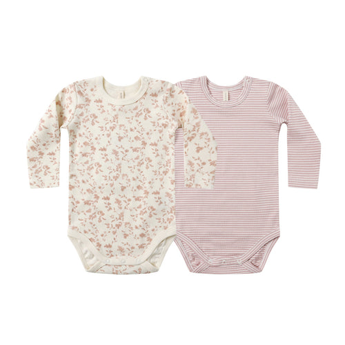 Two baby bodysuits, one with floral pattern and one with pink stripes, on a white background.