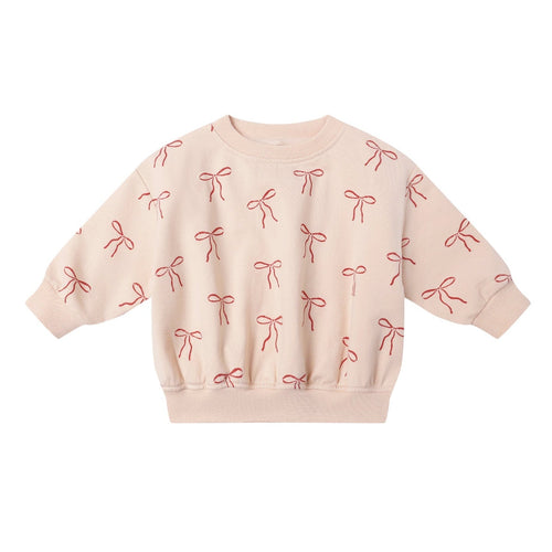 Pink sweatshirt with bow pattern on a white background