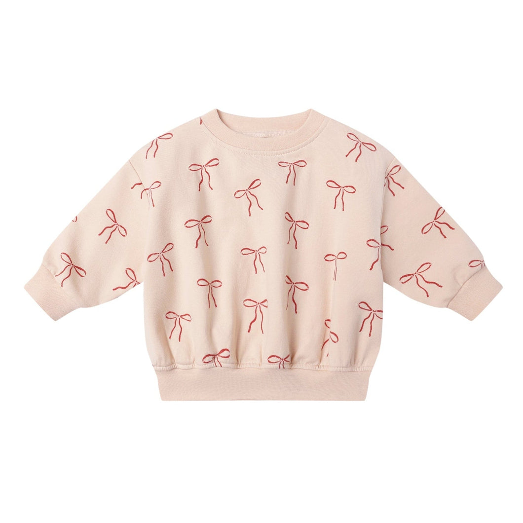 Pink sweatshirt with bow pattern on a white background