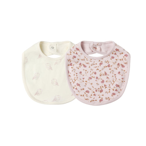 Two baby bibs, one white and one with floral pattern, on a white background