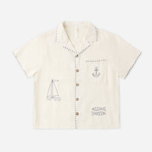Load image into Gallery viewer, Beige children's shirt with embroidered designs on a white background
