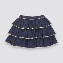 Load image into Gallery viewer, A dark navy blue tiered skirt with a subtle paisley pattern and beige ruffle trim, shown flat against a light gray background.

